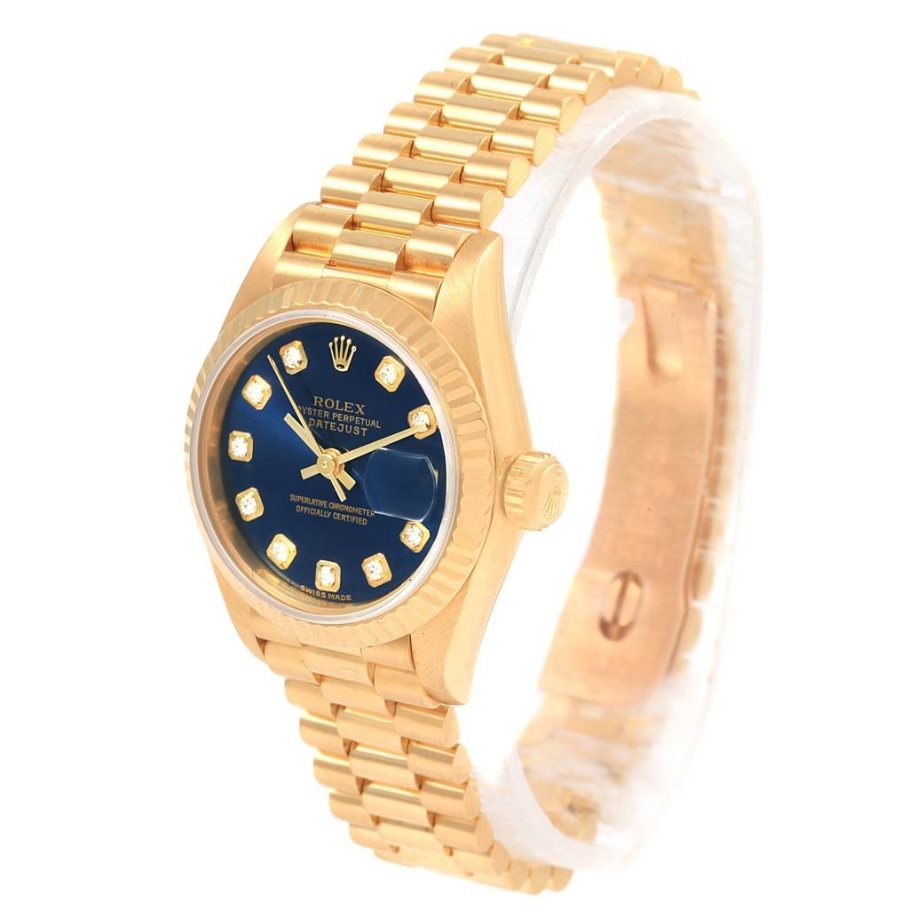 The Rolex President 69178 Women's Yellow Gold Blue Dial 69178 Women's Yellow Gold Blue Dial model watch is shown from a three-quarter angle, featuring its gold bracelet, blue dial, and fluted bezel.
