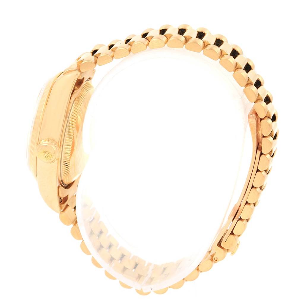 The image shows a side view of a Rolex President 69178 Women's Yellow Gold Champagne Dial 69178 Women's Yellow Gold Champagne Dial model watch, featuring its gold case and President bracelet.