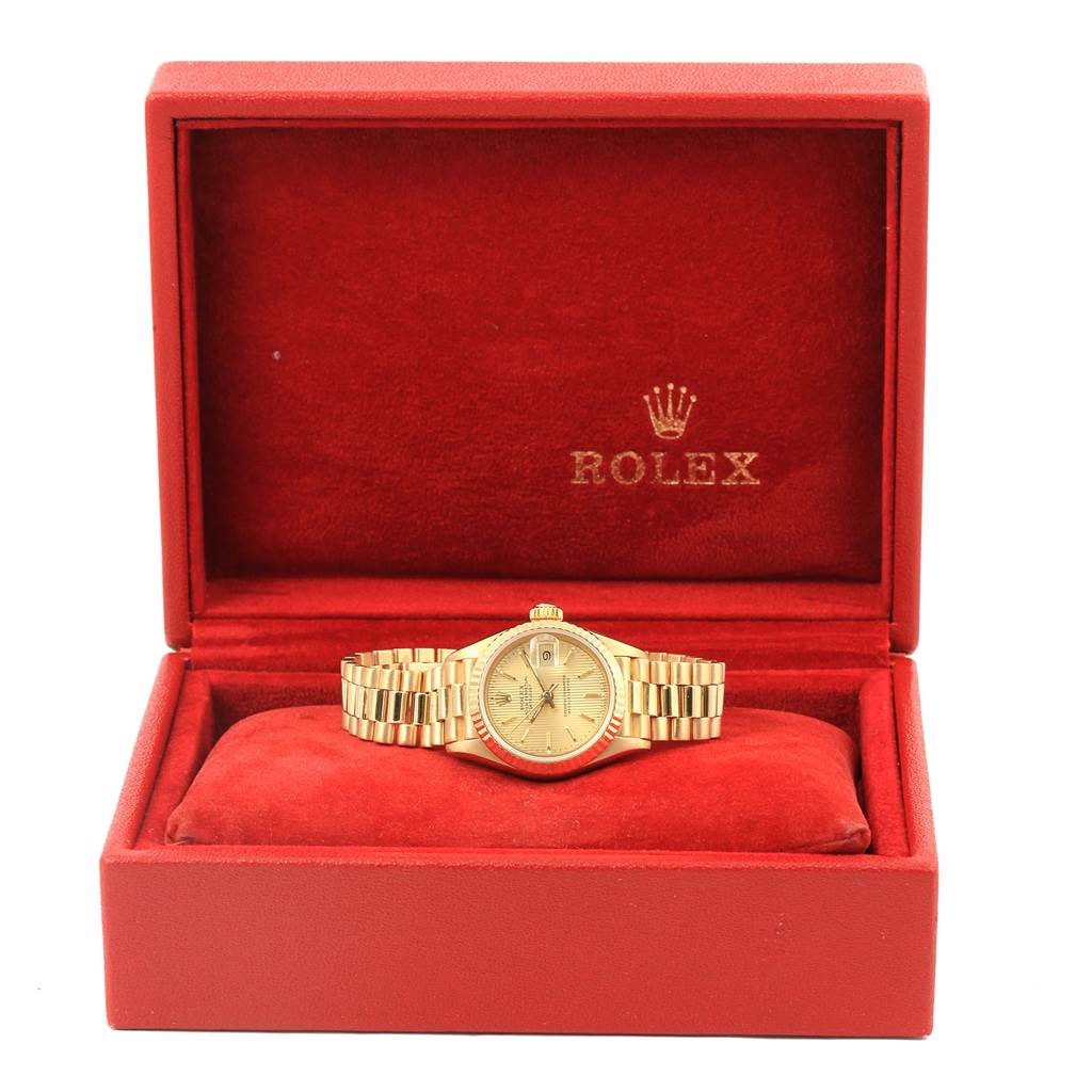 The image shows a Rolex President 69178 Women's Yellow Gold Champagne Dial 69178 Women's Yellow Gold Champagne Dial watch placed inside an open red Rolex box, viewed from the front.