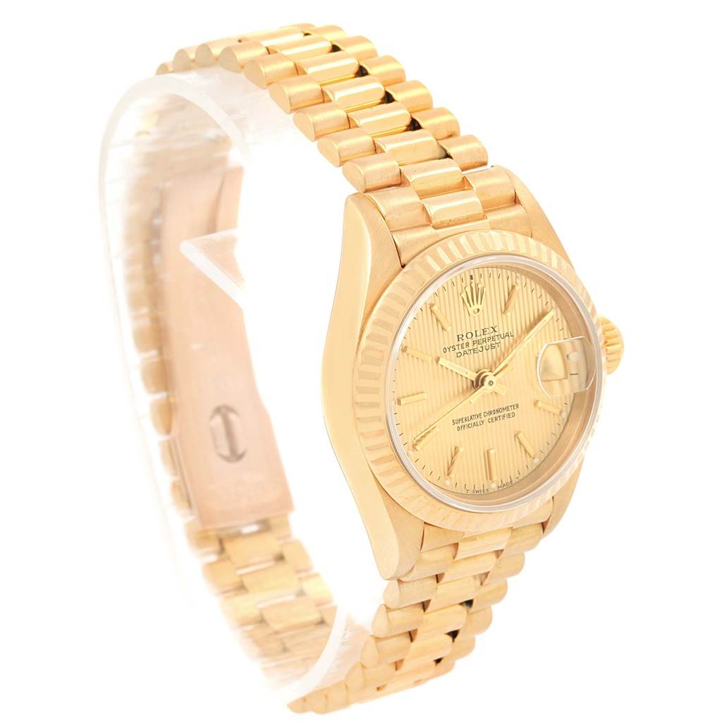 The image shows a Rolex President 69178 Women's Yellow Gold Champagne Dial 69178 Women's Yellow Gold Champagne Dial model watch from a three-quarter angle highlighting the watch face, bezel, and bracelet.