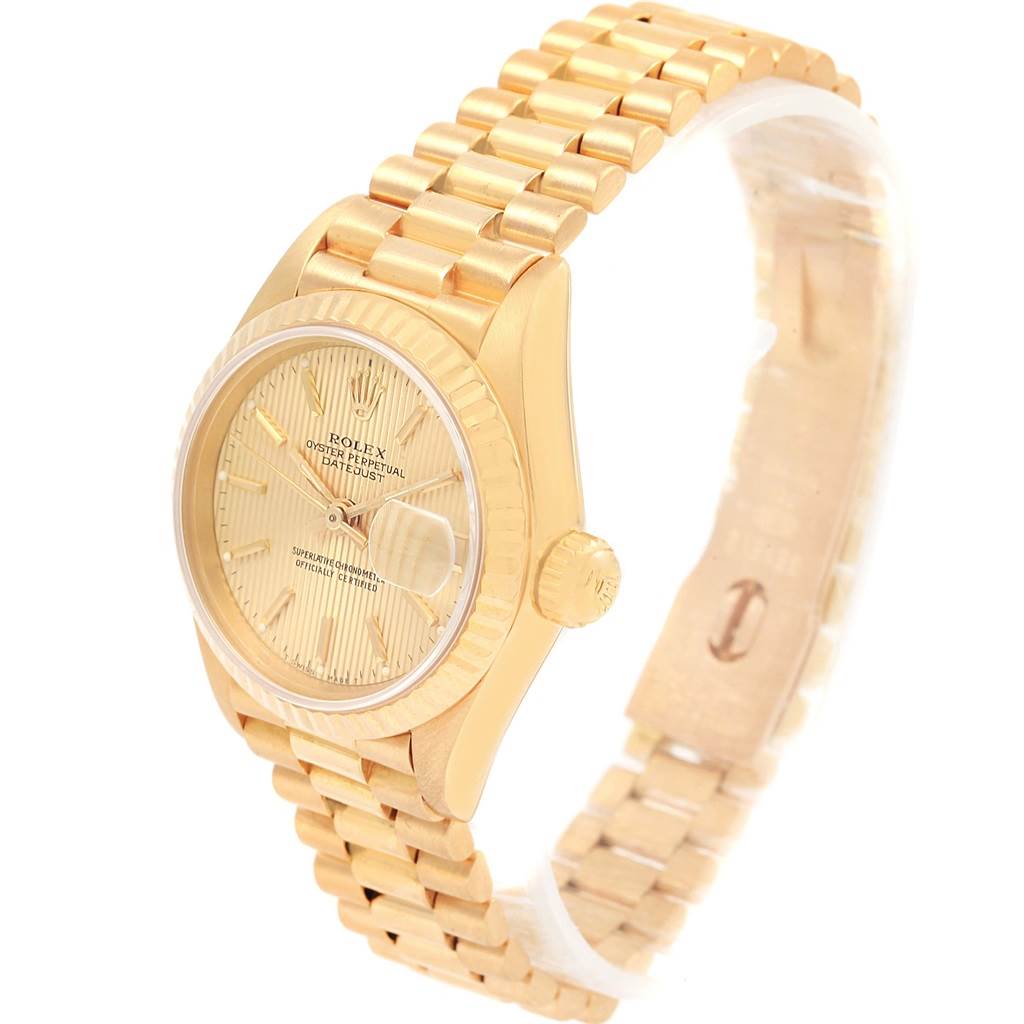 The image shows a side-front angle of a gold Rolex President 69178 Women's Yellow Gold Champagne Dial 69178 Women's Yellow Gold Champagne Dial model watch, highlighting the face, band, and crown.