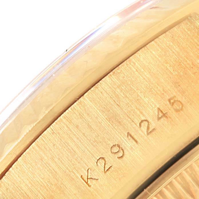 This close-up image shows the engraved serial number on the side of the case of a Rolex President 79178 Women's Yellow Gold Beige Dial 79178 Women's Yellow Gold Beige Dial model watch.