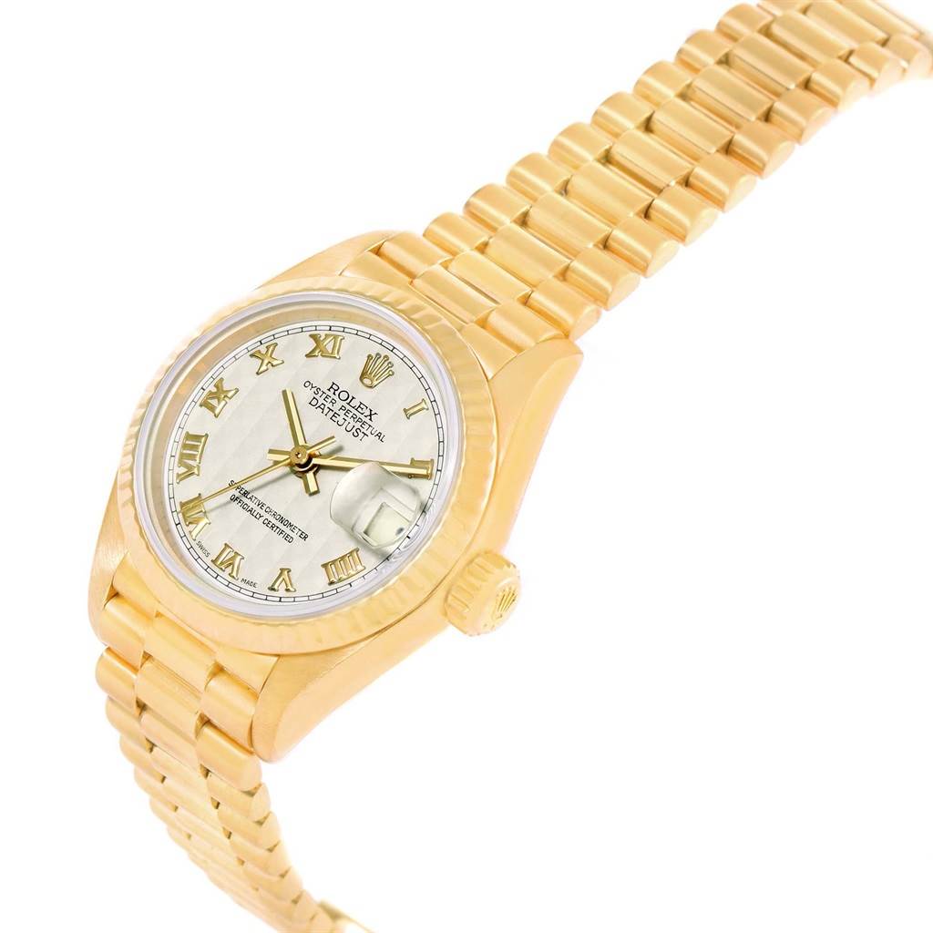 This Rolex President 79178 Women's Yellow Gold Beige Dial 79178 Women's Yellow Gold Beige Dial model watch is shown at an angle displaying its gold bracelet, crown, and dial with Roman numerals.
