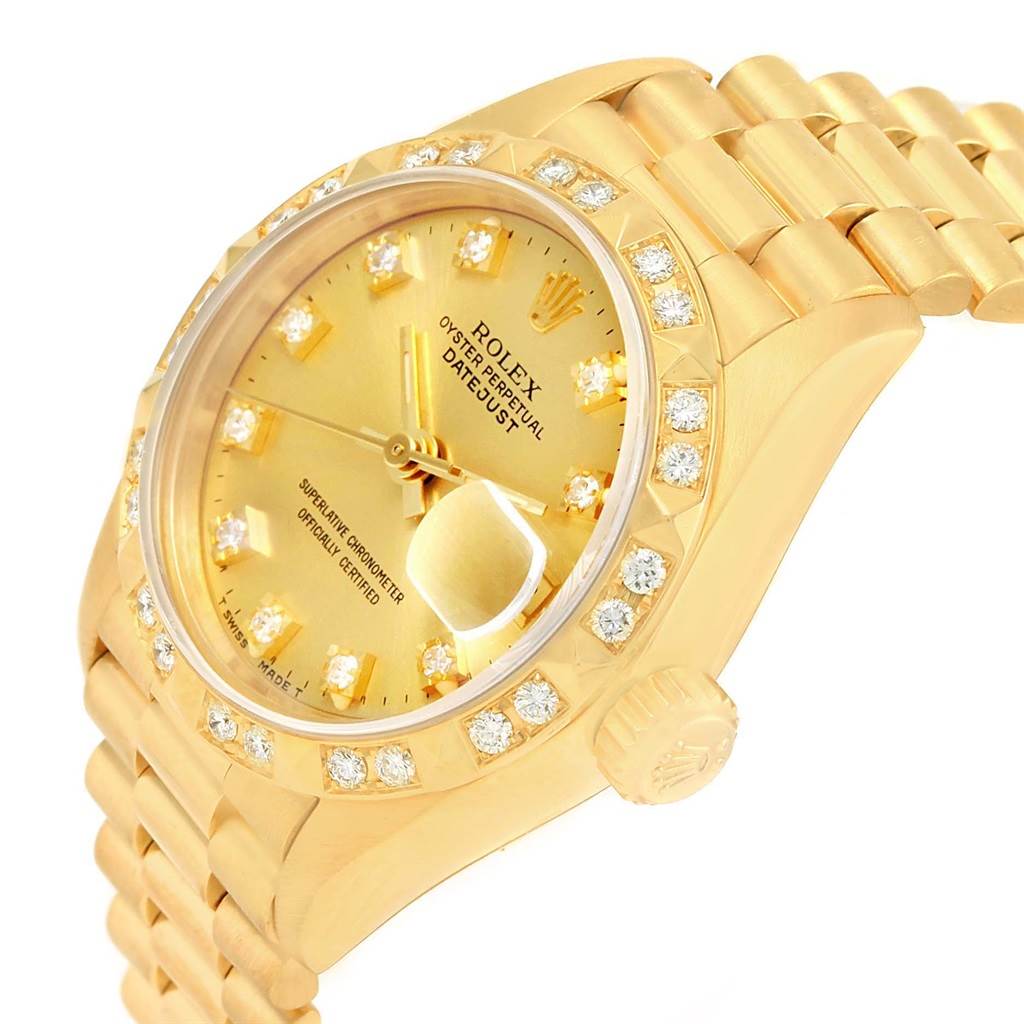 The image shows a side angle of a gold Rolex President 69258 Women's Yellow Gold Champagne Dial 69258 Women's Yellow Gold Champagne Dial model watch, highlighting its diamond-encrusted bezel, crown, and bracelet.