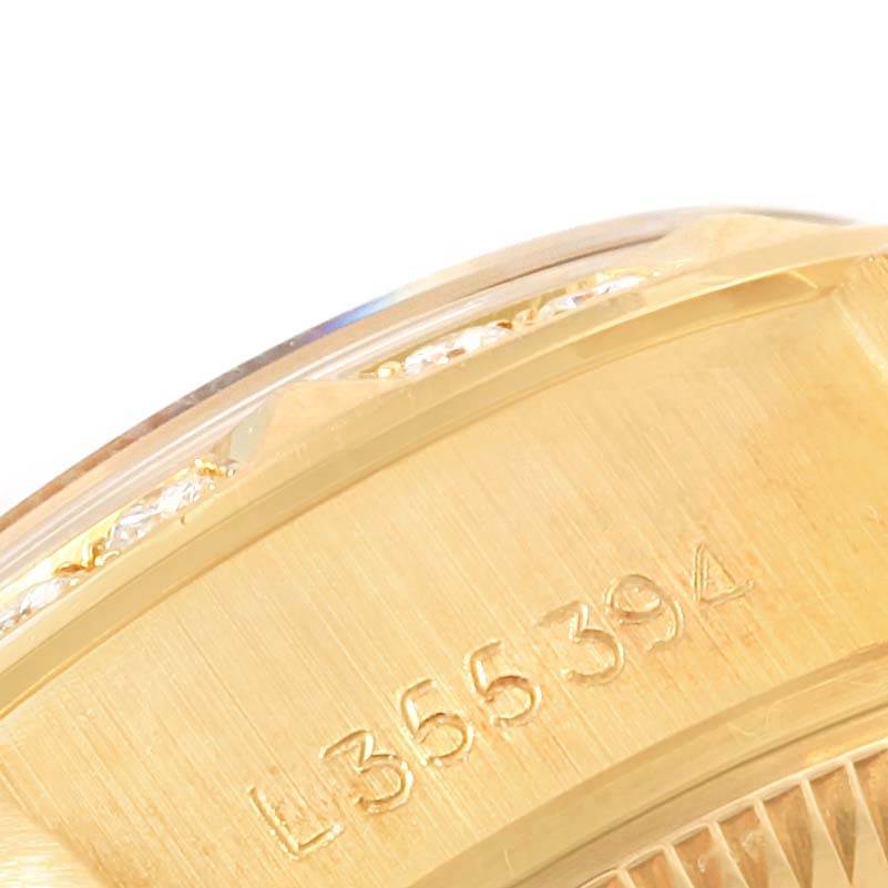 The image shows a close-up of the engraved side of the bezel and part of the case of a Rolex President 69258 Women's Yellow Gold Champagne Dial 69258 Women's Yellow Gold Champagne Dial model watch.