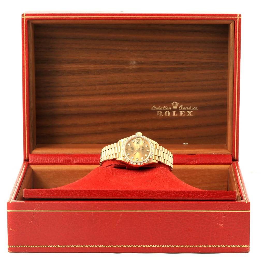 The Rolex President 69258 Women's Yellow Gold Champagne Dial 69258 Women's Yellow Gold Champagne Dial model watch is shown in its open display box, with a clear view of the watch face and bracelet.
