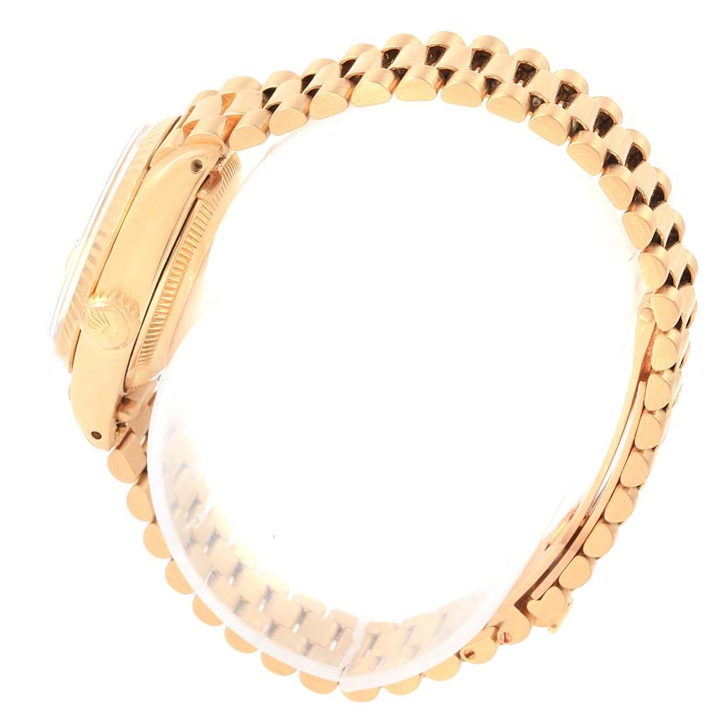 This image shows a side view of the Rolex President 6917 Women's Yellow Gold Champagne Dial 6917 Women's Yellow Gold Champagne Dial watch, highlighting its gold case and bracelet.