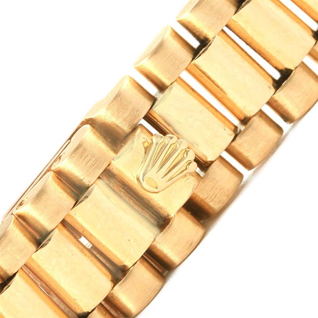 This close-up image shows the gold bracelet with the Rolex logo on the clasp of the Rolex President 6917 Women's Yellow Gold Champagne Dial 6917 Women's Yellow Gold Champagne Dial model.