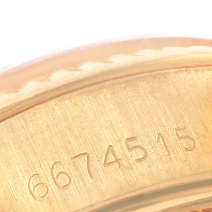 This image shows a close-up of the serial number engraving on the gold case of a Rolex President 6917 Women's Yellow Gold Champagne Dial 6917 Women's Yellow Gold Champagne Dial model watch.