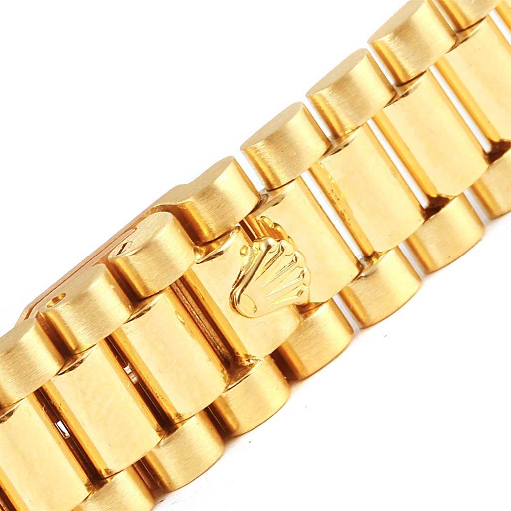 This image shows the gold bracelet of a Rolex President 69138 Women's Yellow Gold Champagne Dial 69138 Women's Yellow Gold Champagne Dial model watch, focusing on the clasp with the Rolex crown logo.