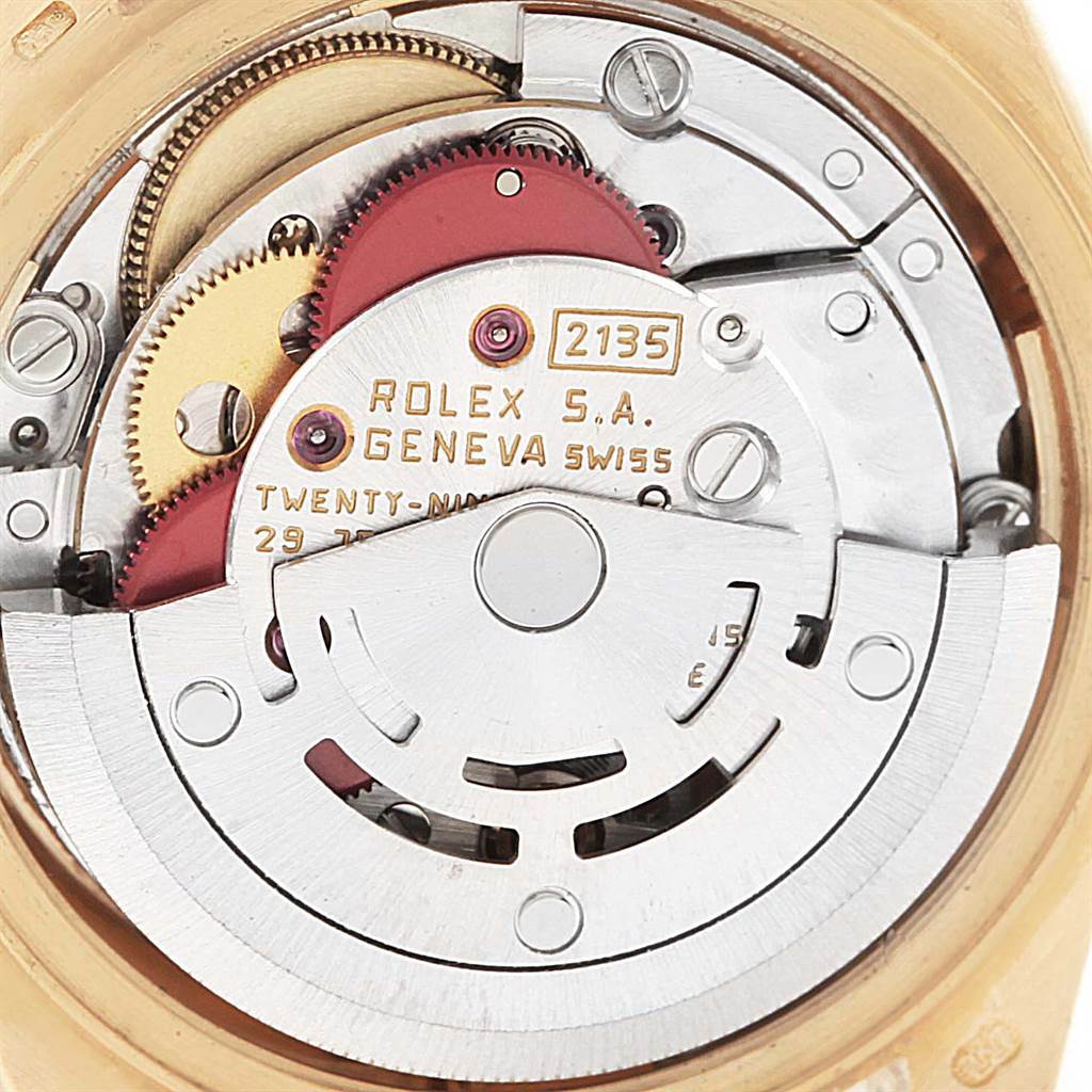 The image shows a close-up view of the movement mechanism of a Rolex President 69158 Women
s Yellow Gold Champagne Dial 69158 Women
s Yellow Gold Champagne Dial model watch.