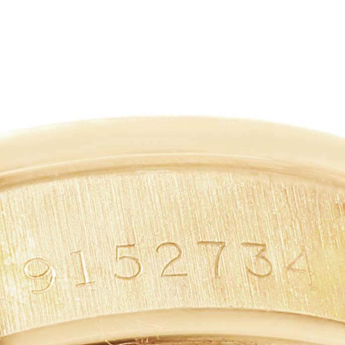 This image shows a close-up of the serial number engraved on the case of a Rolex President 69158 Women
s Yellow Gold Champagne Dial 69158 Women
s Yellow Gold Champagne Dial model watch.