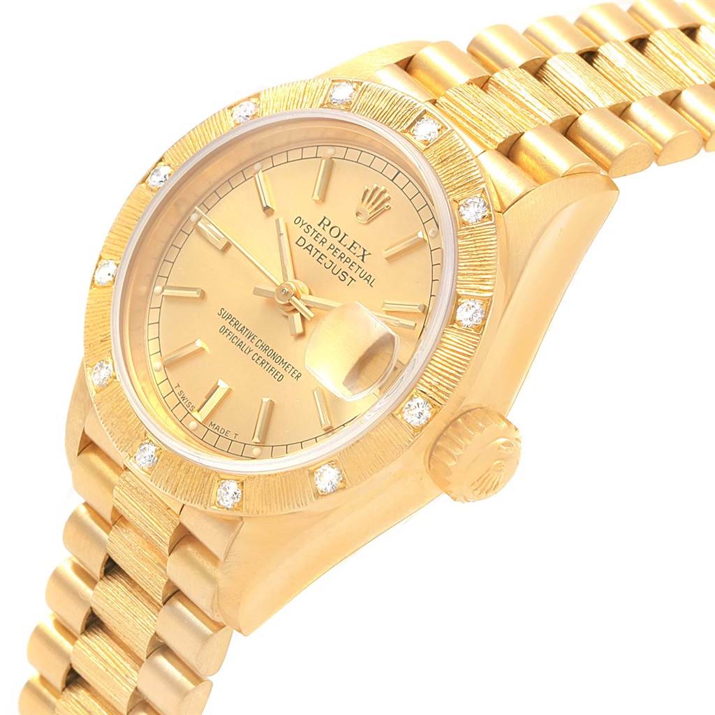 The image shows a side angle of the Rolex President 69288 Women's Yellow Gold Champagne Dial 69288 Women's Yellow Gold Champagne Dial Datejust, highlighting the gold case, bracelet, dial, and diamond-bezel.