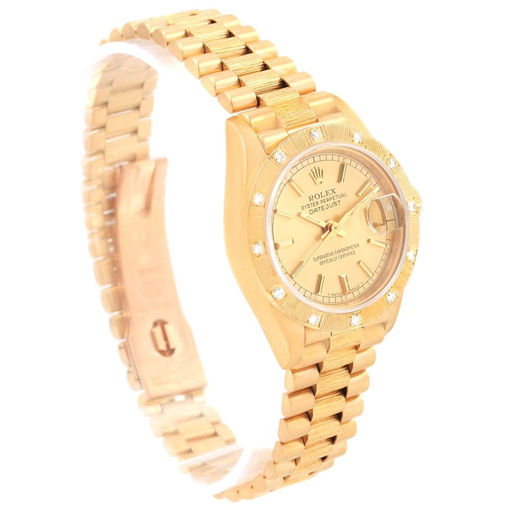 The image shows a side angle of a Rolex President 69288 Women's Yellow Gold Champagne Dial 69288 Women's Yellow Gold Champagne Dial model watch, highlighting its gold bracelet and diamond-accented dial.