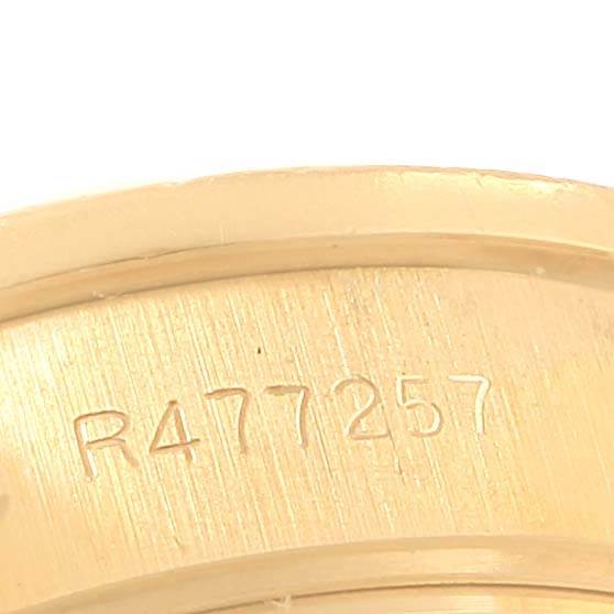 This close-up image shows the serial number engraved on the band of a Rolex President 69288 Women's Yellow Gold Champagne Dial 69288 Women's Yellow Gold Champagne Dial model watch.