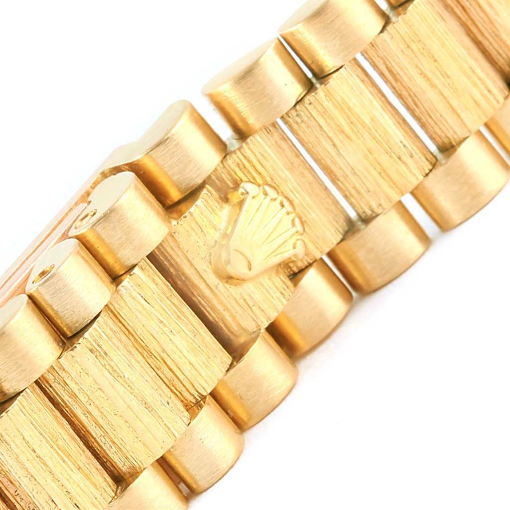 This close-up image shows the gold bracelet clasp of a Rolex President 69288 Women's Yellow Gold Champagne Dial 69288 Women's Yellow Gold Champagne Dial model watch.