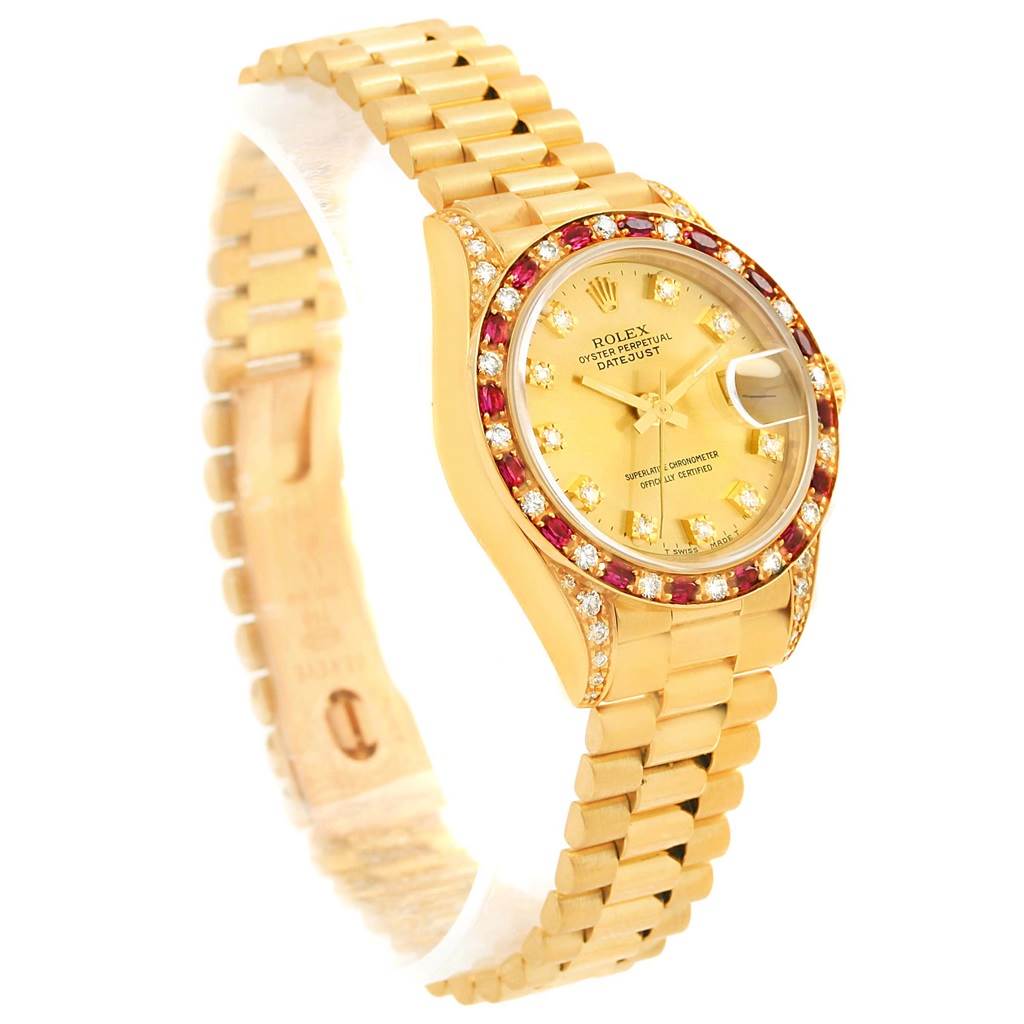 The image shows a Rolex President 69198 Women's Yellow Gold Champagne Dial 69198 Women's Yellow Gold Champagne Dial model watch from a three-quarter angle, highlighting the gold bracelet, diamond-encrusted bezel, and dial.