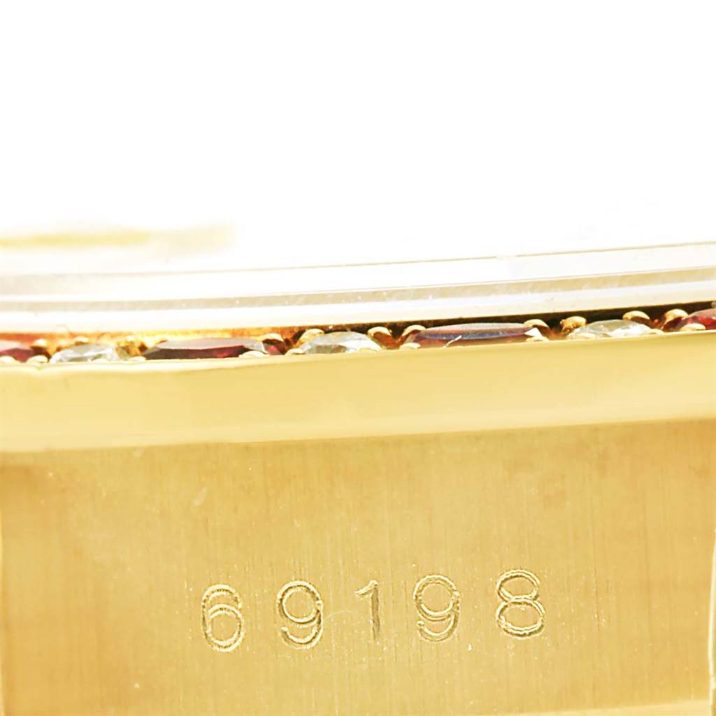 This close-up angle shows the side of the Rolex President 69198 Women's Yellow Gold Champagne Dial 69198 Women's Yellow Gold Champagne Dial model watch, focusing on the model number 69198 engraved on the case.