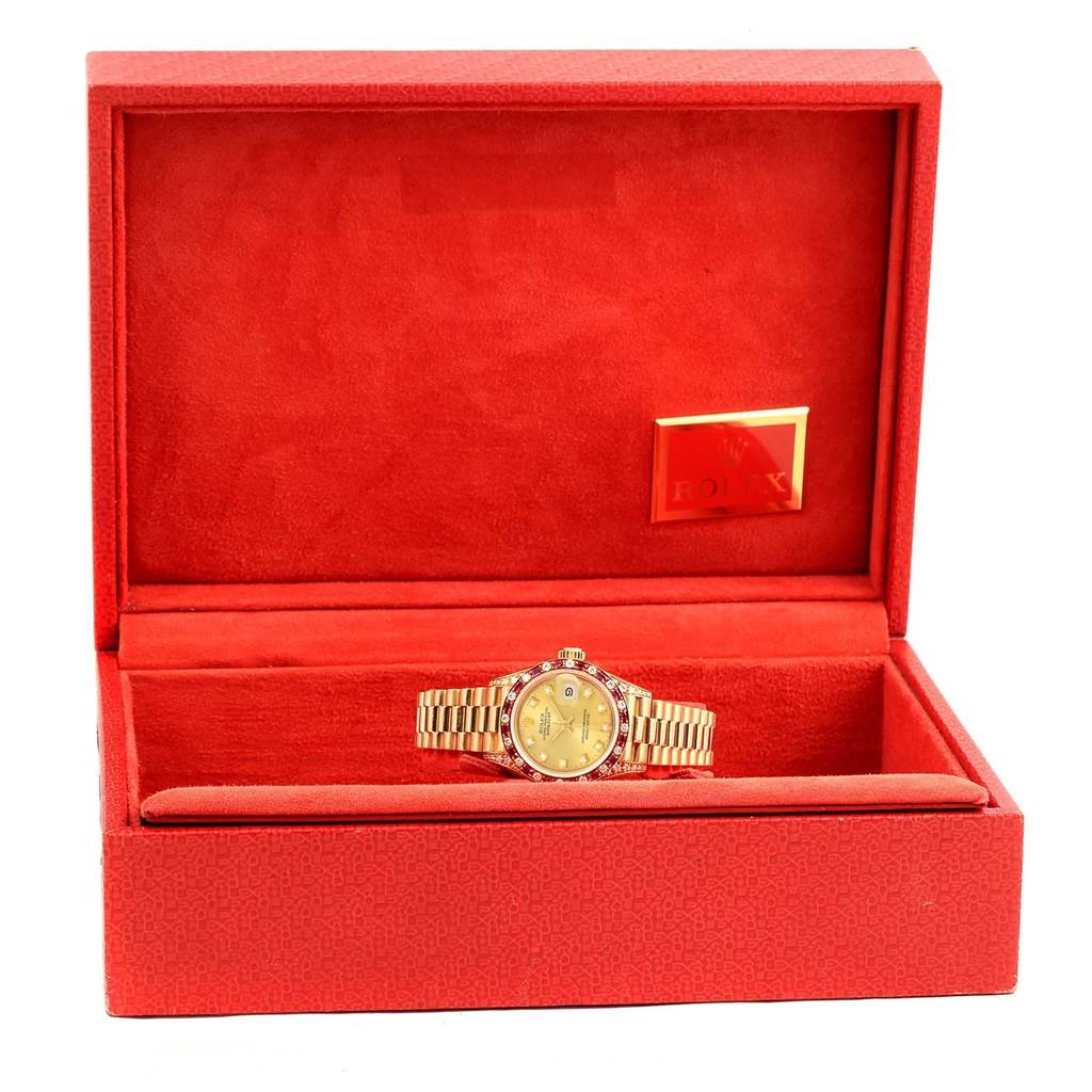 The image shows a Rolex President 69198 Women's Yellow Gold Champagne Dial 69198 Women's Yellow Gold Champagne Dial model watch, displayed front-facing in an open red case.