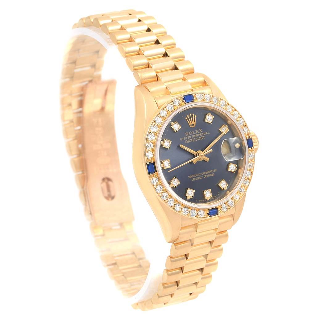 The image shows a Rolex President 69088 Women's Yellow Gold Blue Dial 69088 Women's Yellow Gold Blue Dial model watch at a slight diagonal angle, displaying its band, face, and bezel with diamonds.