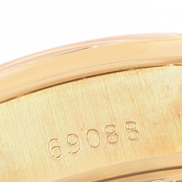 The image shows a close-up angle of the serial number on the casing of a Rolex President 69088 Women's Yellow Gold Blue Dial 69088 Women's Yellow Gold Blue Dial model watch.