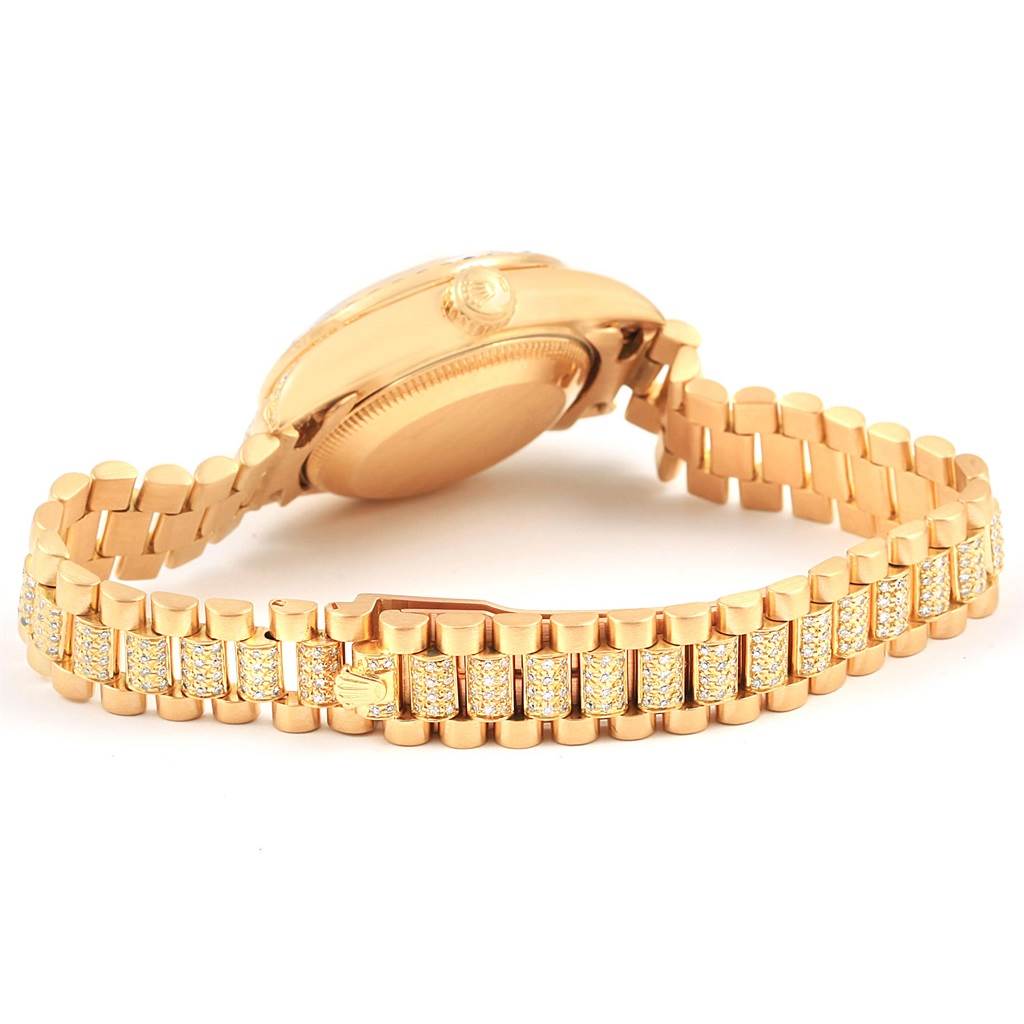 This image shows the back and the band of the President model watch by Rolex at an angle that highlights the clasp and bracelet.