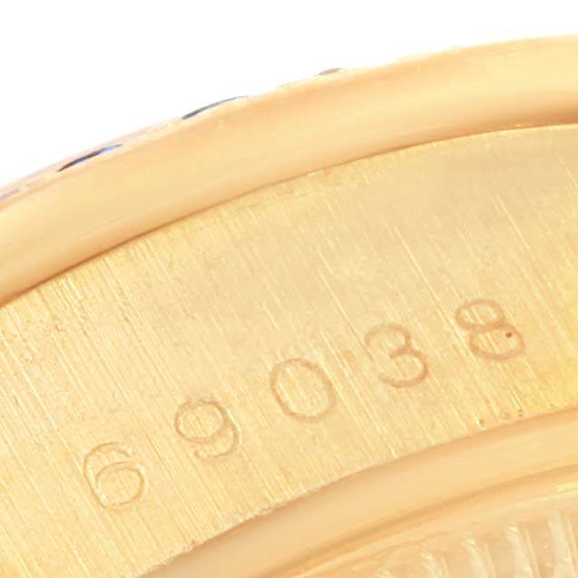 The image shows a close-up of the serial number engraved on the case back of the Rolex President 69038 Women's Yellow Gold Blue Dial 69038 Women's Yellow Gold Blue Dial model watch.