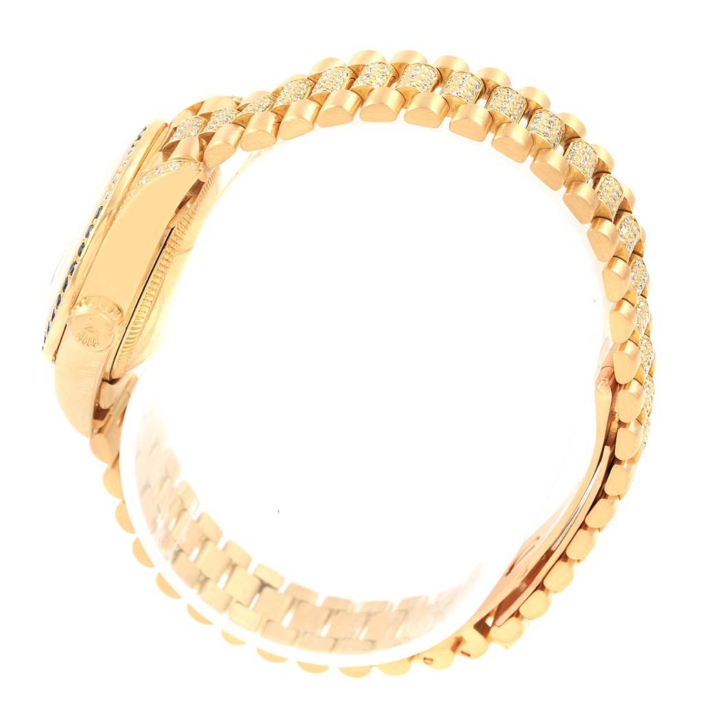 The image shows a side view of the Rolex President 69038 Women's Yellow Gold Blue Dial 69038 Women's Yellow Gold Blue Dial model watch, highlighting its gold bracelet and case.