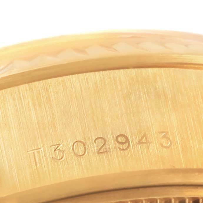 This image shows a close-up of the serial number engraved on the gold case of a Rolex President 69178 Women's Yellow Gold Mother of Pearl Dial 69178 Women's Yellow Gold Mother of Pearl Dial model watch.