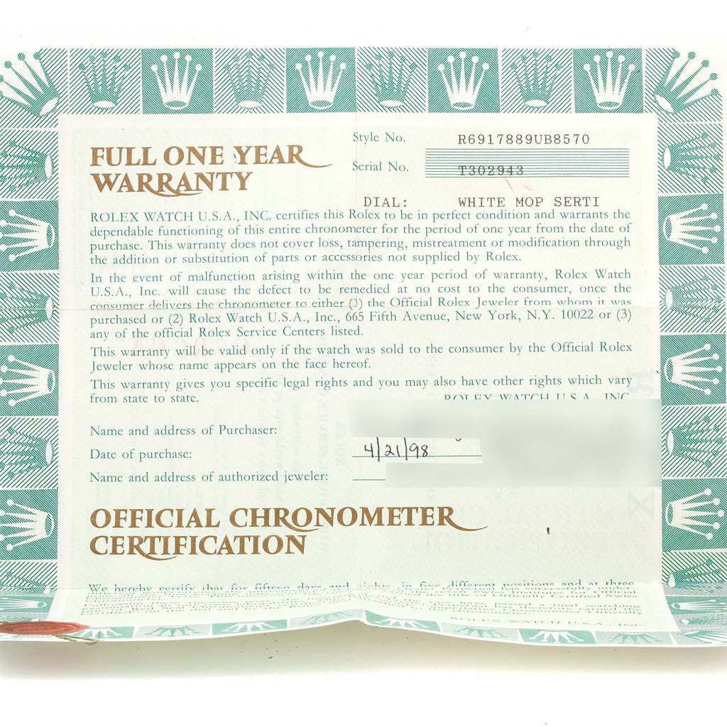 This image shows a full one-year warranty certificate for a President model Rolex watch, including style and serial numbers.