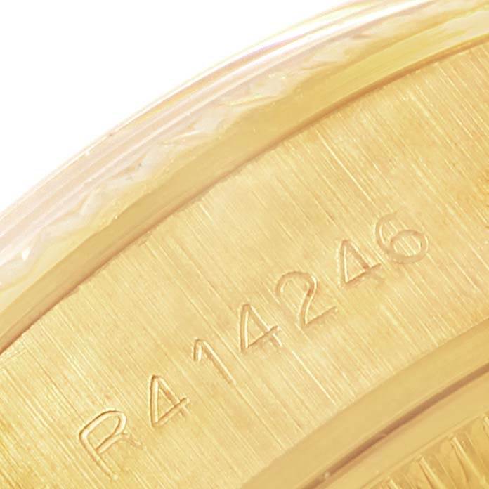 This close-up image shows the serial number engraved on the side of a Rolex President 69178 Women's Yellow Gold Champagne Dial 69178 Women's Yellow Gold Champagne Dial watch.