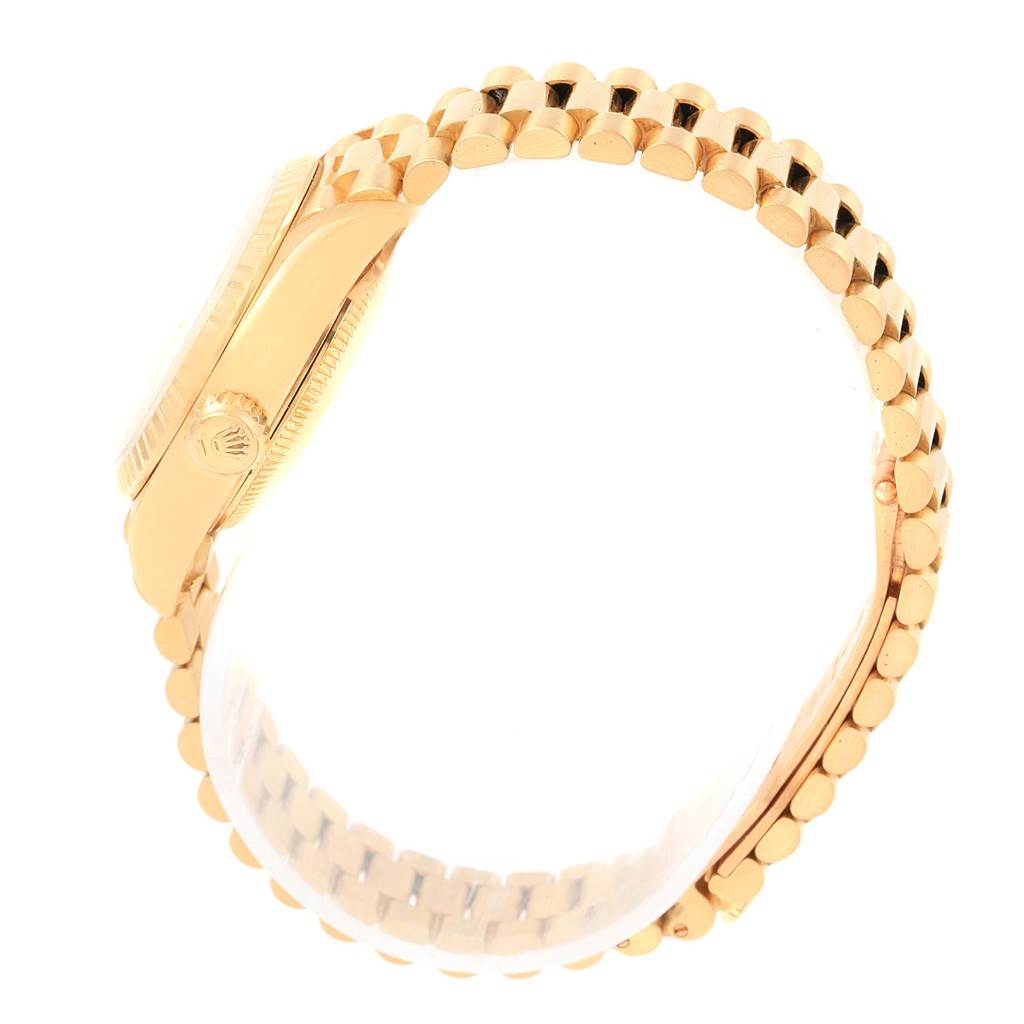 The image shows a side view of the Rolex President 69178 Women's Yellow Gold Champagne Dial 69178 Women's Yellow Gold Champagne Dial watch, highlighting the gold casing, crown, and bracelet.