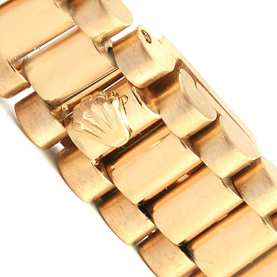 The image shows a close-up of the gold bracelet links and crown clasp of a Rolex President 69178 Women's Yellow Gold Champagne Dial 69178 Women's Yellow Gold Champagne Dial model watch.
