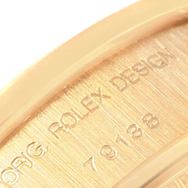 This close-up image shows the engraving on the back case of a Rolex President 79138 Women's Yellow Gold Champagne Dial 79138 Women's Yellow Gold Champagne Dial watch.