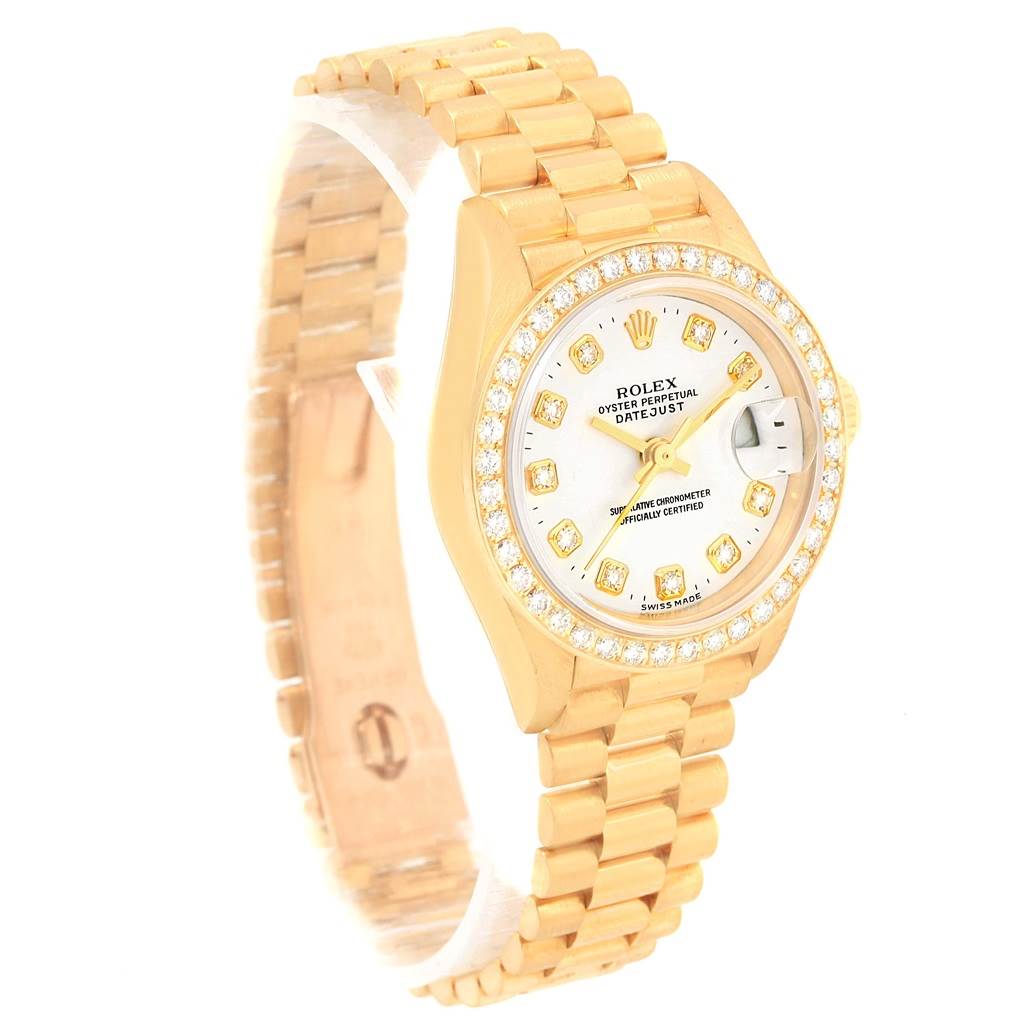 This image shows a Rolex President 79138 Women's Yellow Gold White Dial 79138 Women's Yellow Gold White Dial Datejust watch from an oblique angle, highlighting the dial, bezel, band, and crown.