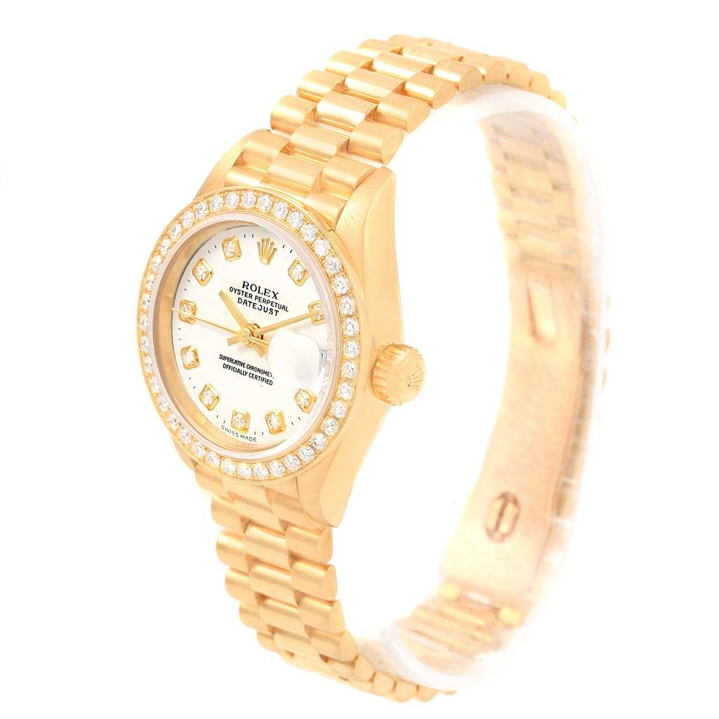 The image shows a gold Rolex President 79138 Women's Yellow Gold White Dial 79138 Women's Yellow Gold White Dial model watch at a slight angle, highlighting its face, bezel, crown, and bracelet.