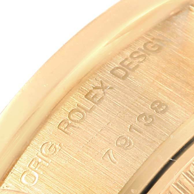The image shows a close-up of the engraved inner casing of a Rolex President 79138 Women's Yellow Gold White Dial 79138 Women's Yellow Gold White Dial model watch.