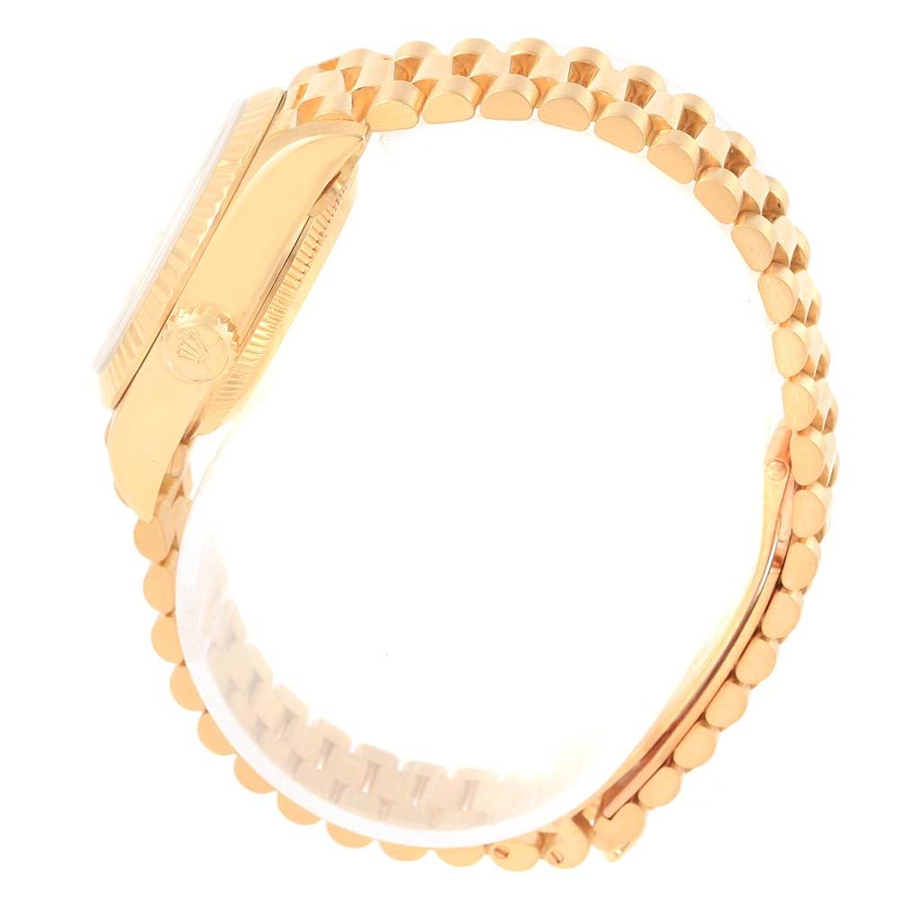 The image shows a side view of a Rolex President 79178 Women's Yellow Gold White Dial 79178 Women's Yellow Gold White Dial model watch, highlighting its crown, case, and gold bracelet.