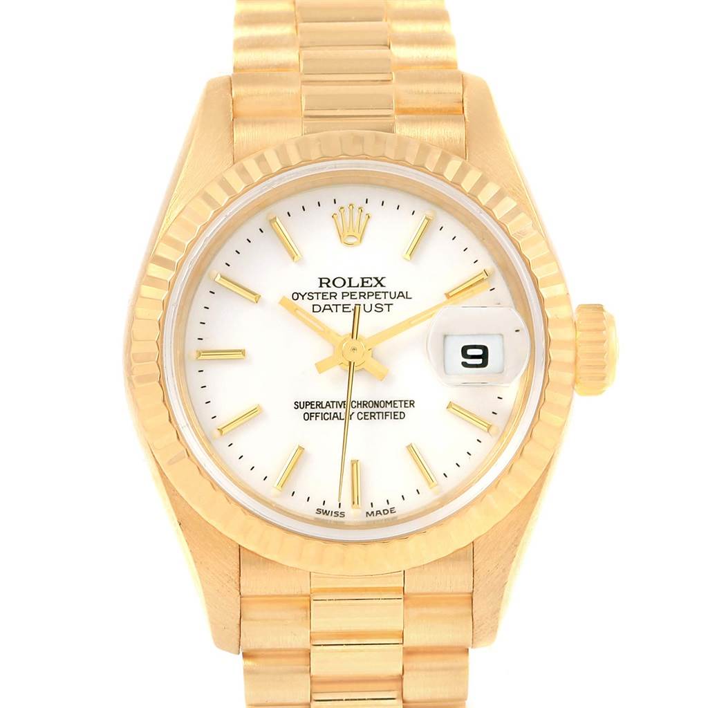 The image shows a close-up of the Rolex President 79178 Women's Yellow Gold White Dial 79178 Women's Yellow Gold White Dial watch with its face, bezel, crown, and bracelet partially visible.