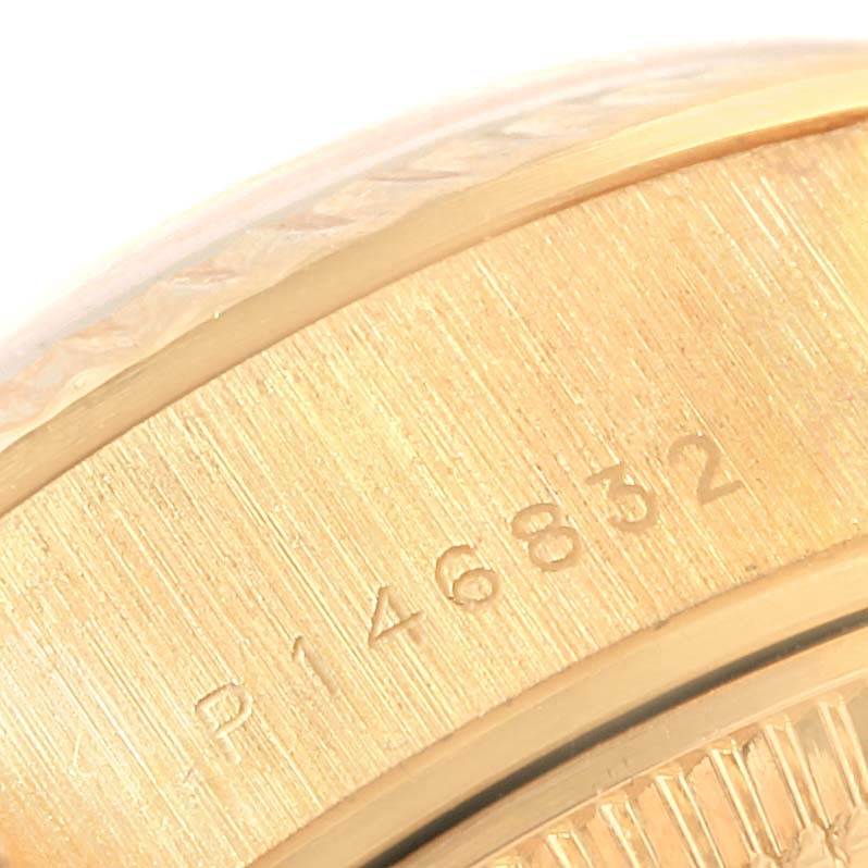 This close-up image of the Rolex President 79178 Women's Yellow Gold White Dial 79178 Women's Yellow Gold White Dial watch shows part of the casing with a partial serial number.