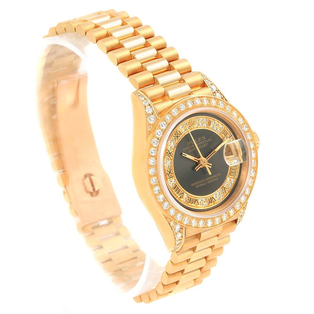 The watch is a gold Rolex President 69158 Women's Yellow Gold Grey Dial 69158 Women's Yellow Gold Grey Dial model viewed at an angle, showcasing its face, bezel with diamonds, and bracelet.
