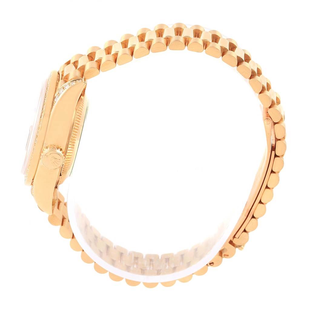 This side-angle view of the Rolex President 69158 Women's Yellow Gold Grey Dial 69158 Women's Yellow Gold Grey Dial model watch showcases its gold bracelet, crown, and part of the casing.