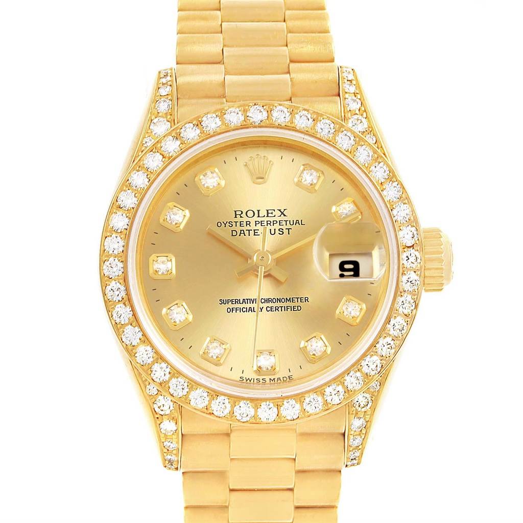 This image shows the front view of the Rolex President 69158 Women's Yellow Gold Champagne Dial 69158 Women's Yellow Gold Champagne Dial model, showcasing its gold face, date display, and diamond-studded bezel and bracelet.