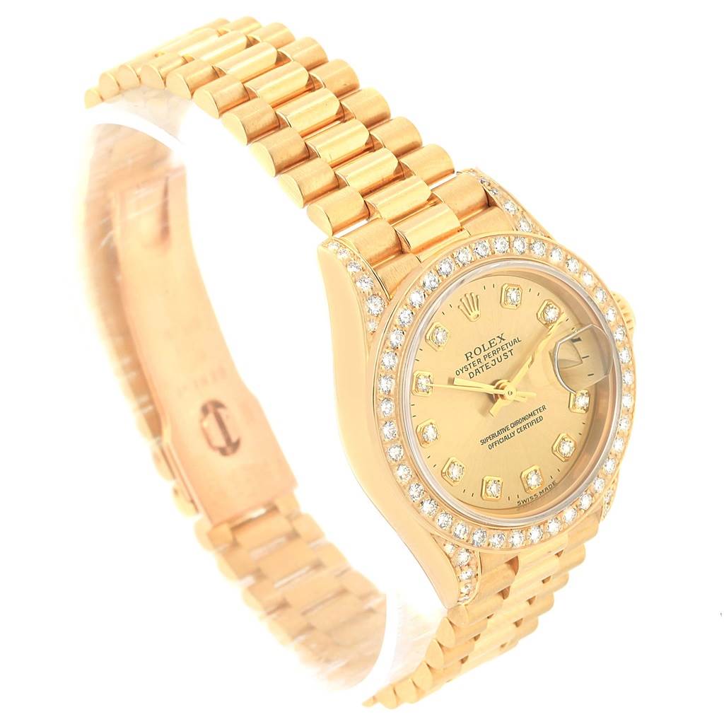 The image shows an angled view of the Rolex President 69158 Women's Yellow Gold Champagne Dial 69158 Women's Yellow Gold Champagne Dial model watch, highlighting the gold bracelet, diamond bezel, and face.