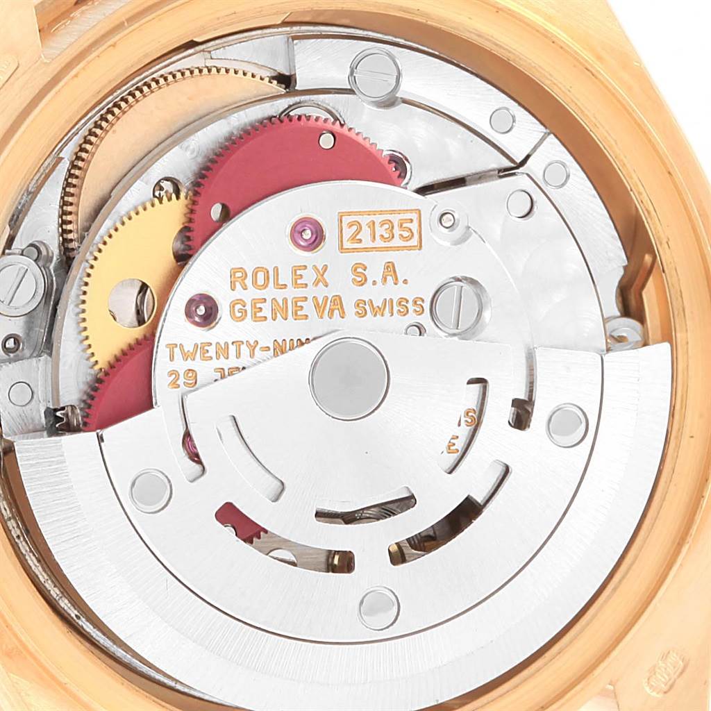 This image shows a close-up of the Rolex President 69158 Women's Yellow Gold Champagne Dial 69158 Women's Yellow Gold Champagne Dial model's movement, including gears and internal mechanics.