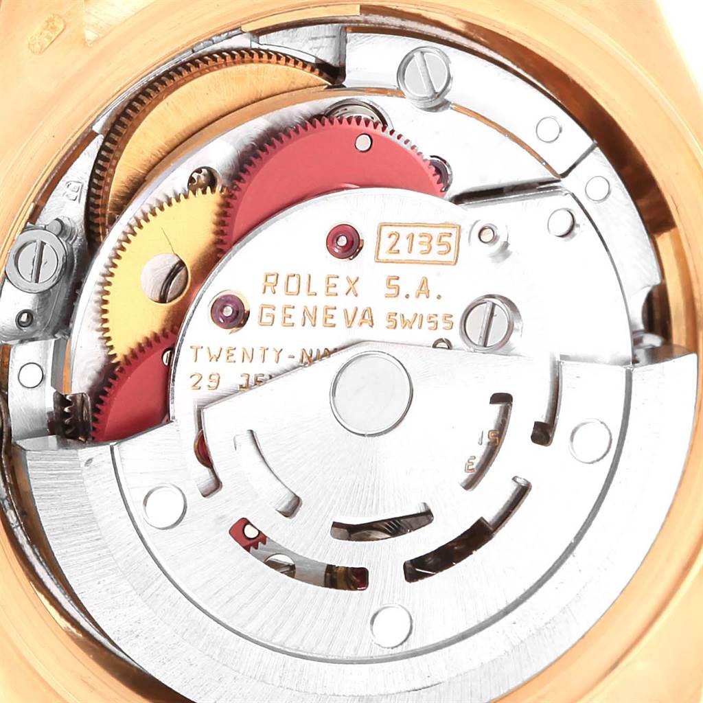 This image shows the intricate internal mechanism of a Rolex President 69288 Women's Yellow Gold Beige Dial 69288 Women's Yellow Gold Beige Dial model watch, focusing on its gears and movement components.