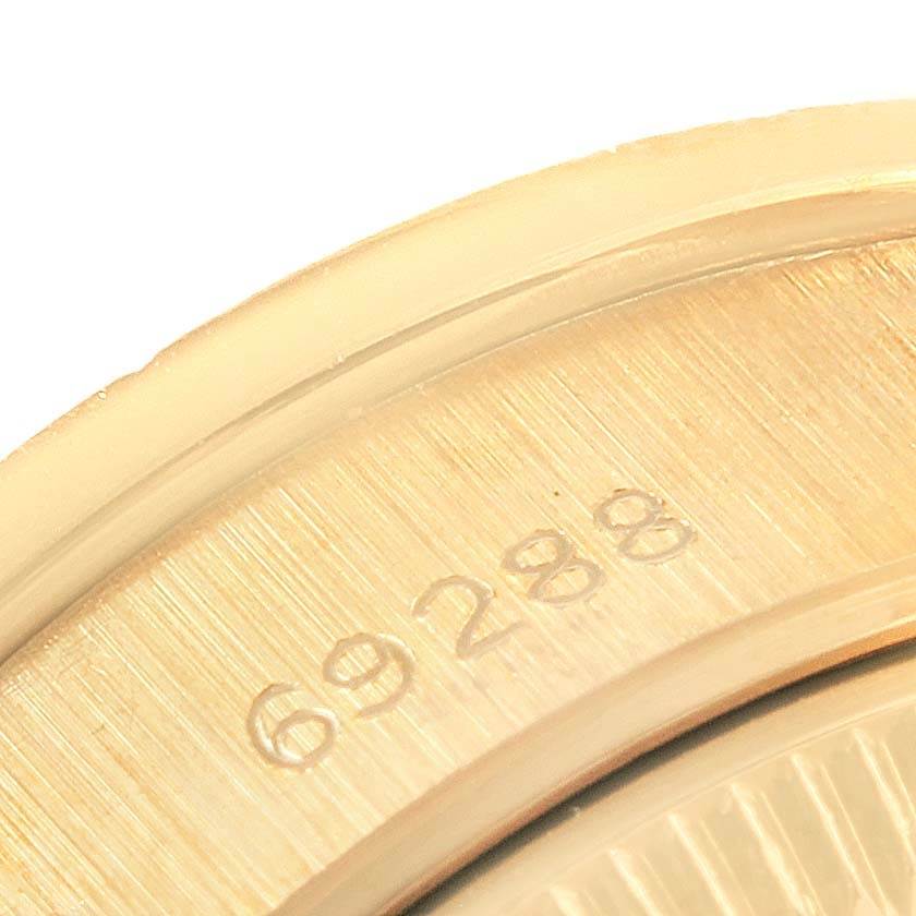 This image shows a close-up of the case back edge on a Rolex President 69288 Women's Yellow Gold Beige Dial 69288 Women's Yellow Gold Beige Dial model watch.