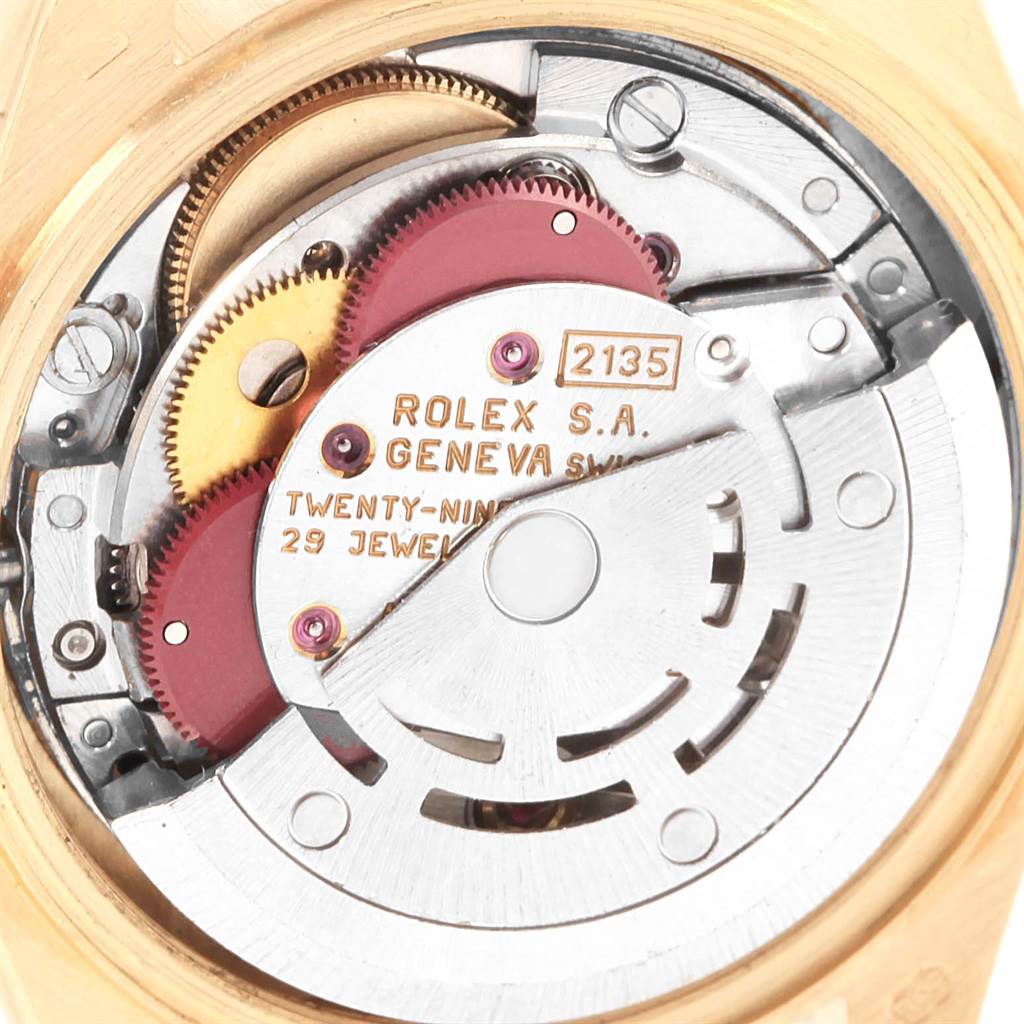 This close-up image shows the intricate internal mechanics of the Rolex President 69258 Women's Yellow Gold Black Dial 69258 Women's Yellow Gold Black Dial model watch.
