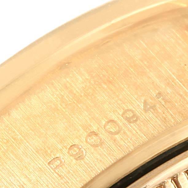 This image shows a close-up of the inner case of the Rolex President 79138 Women's Yellow Gold Champagne Dial 79138 Women's Yellow Gold Champagne Dial watch, highlighting the engraved serial number.