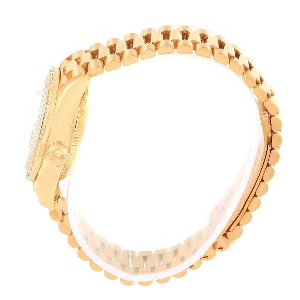 This image shows a side view of the Rolex President 79138 Women's Yellow Gold Champagne Dial 79138 Women's Yellow Gold Champagne Dial model watch, highlighting its gold case, crown, and bracelet.